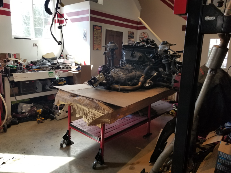 One table helped move the S4's engine out of the way until it was needed. There are wheels there, but the engine and transmission certainly outweighed their capacity.